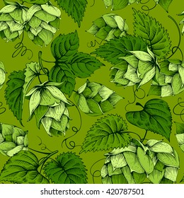 Vintage seamless pattern with green hops and leaves. Hops hand drawn in artistic engraved style. Vector illustration.