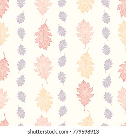 Vintage seamless pattern from the leaves of red oak arranged vertically on a beige background (Quercus rubra)