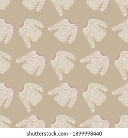 Vintage seamless pattern with light tones sweater cozy print. Beige pastel background. Vector illustration for seasonal textile prints, fabric, banners, backdrops and wallpapers.