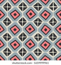 Tama inmaculado con un mosaico en azul, rosa y negro sobre fondo crema.