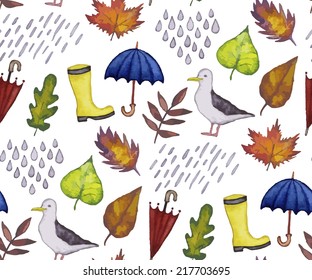 Vintage seamless pattern with rain drops, leaves, rubber boots and umbrellas. Watercolor paint. Autumn theme. 
