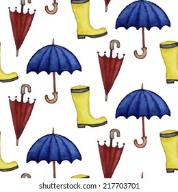 Vintage seamless pattern with rubber boots and umbrellas. Watercolor paint. Autumn theme. 