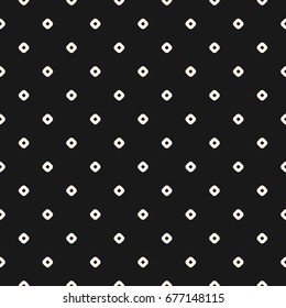 Vintage seamless pattern with small circles, tiny perforated rounded shapes. Simple stylish geometric texture. Dark monochrome polka dot background. Repeat design for decor, prints, textile, package