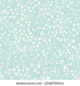 Vintage seamless tiny floral pattern. Turquoise background with small light yellow flowers. Design for wallpaper, clothing, packaging, fabric, cover, textiles