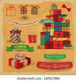 Vintage set with various Christmas gifts and ribbons  on old paper background and grunge frame
