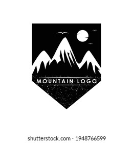 Vintage shield mountain logo design vector