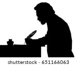 Vintage Silhouette of a bearded man writing with feather at table