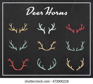 Vintage silhouettes of different deer horns, vector illustration on texture background