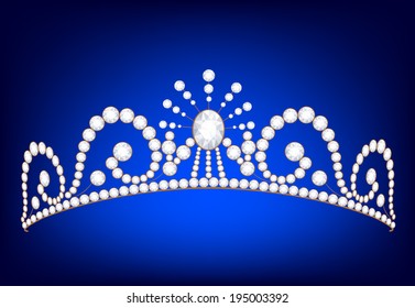 Vintage silver tiara with jewels on dark blue background