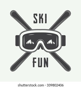 Vintage ski or winter sports logo, emblem, badge, label or watermark with mask in retro style. Vector illustration