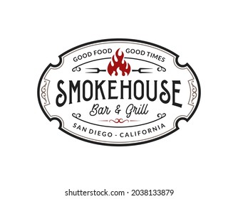 Vintage smokehouse bbq barbecue barbeque bar and grill logo design with fork and fire