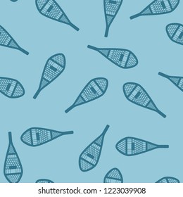 vintage snowshoes on blue background - seamless pattern. flat style.