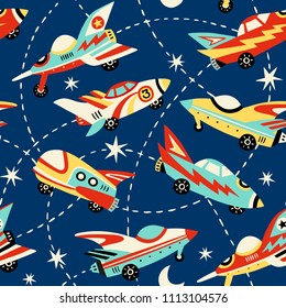 Vintage space cars seamless vector pattern on dark blue background. Cute hand drawn cars, rockets, stars and moon. Perfect for fabric, wallpaper or wrapping paper. 
