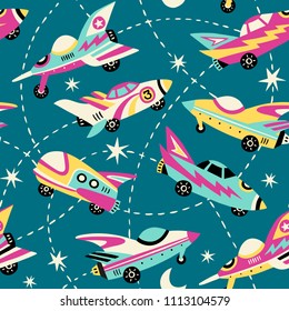 Vintage space cars seamless vector pattern on blue background. Cute hand drawn cars, rockets, stars and moon. Perfect for fabric, wallpaper or wrapping paper. 
