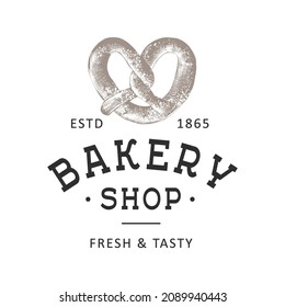 Vintage style bakery shop simple label, badge, emblem, logo template. Graphic food art with engraved pretzel design vector element with typography. Hand drawn organic bagel on white background.