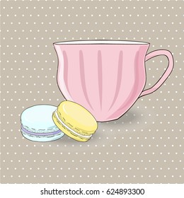 Vintage style picture of tea cup with two sweet colored macarons on the polka dotted background.