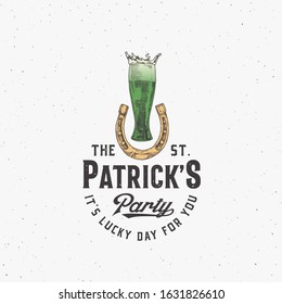 Vintage Style Saint Patricks Day Logo or Label Template. Hand Drawn Beer Glass in a Horseshoe Sketch Symbols with Retro Typography. Shabby Texture Background. Isolated.