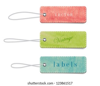 Vintage style textured colored paper cardboard badges with straps