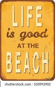 Vintage style tin sign with text "Life is good at the Beach".