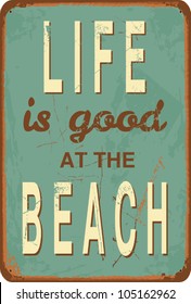 Vintage style tin sign with text "Life is good at the Beach".