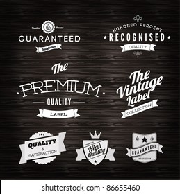 Vintage Styled Premium Quality and Satisfaction Guarantee Label  collection in white on black grungy background design.