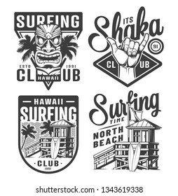 Vintage surfing logos set with tribal tiki mask shaka hand sign surfer house on tropical beach in monochrome style isolated vector illustration