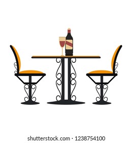 Vintage table and chairs with wine