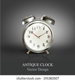 Vintage table clock over dark background