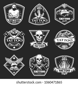 Vintage Tatoo Studio Logos Set With Master Machine Wings Skull Ribbons Flowers Heart Diamond Anchor On Dark Background Isolated Vector Illustration