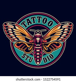 Vintage tattoo salon round logotype with beautiful flying colorful death head butterfly on dark background isolated vector illustration