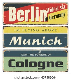 Vintage tin sign collection with Germany cities. Berlin. Munich. Cologne. Retro souvenirs or postcard templates on rust background.