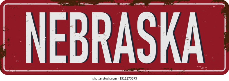 Vintage tin sign with USA state. Nebraska. Retro souvenirs or old paper postcard templates on rust background. States of America.