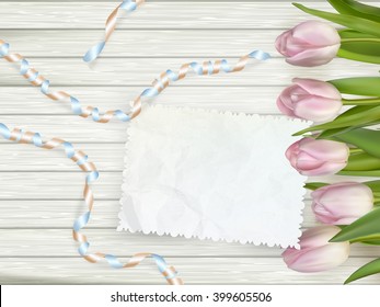 Vintage toned tulips and note paper on a wooden background. EPS 10 vector file included