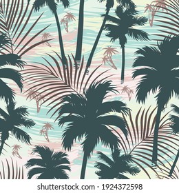 Vintage tropical seamless pattern with palm trees and leaves silhouettes vector illustration