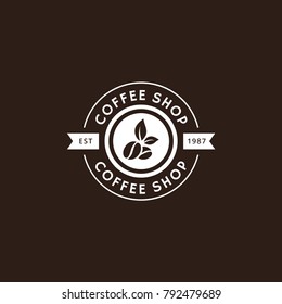 Vintage vector coffee logo and label in white color. Coffee logo template. Caffeine logotype. Retro vintage insignia. Retro coffee badge. Vector illustration