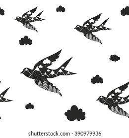 Vintage vector hand drawn style seamless pattern with black bird silhouette, forest and mountains. Inspirational and motivational illustration 