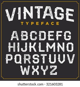 Vintage vector retro font. Stamped type, white scratched letters on grey background