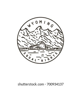 Vintage vector round label. Wyoming. Rocky Mountains.