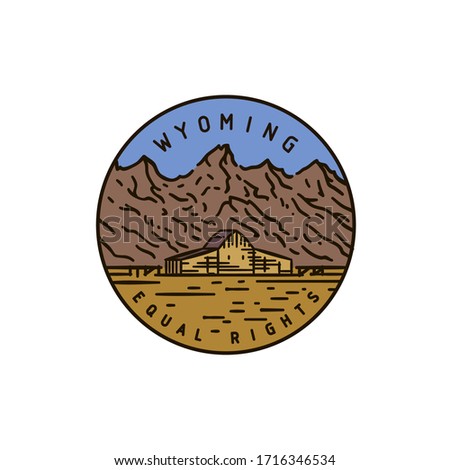 Vintage vector round label. Wyoming. Rocky Mountains