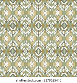 Vintage vector seamless pattern in ikat style. Retro ikat green yellow white pattern with abstract peacock feathers.