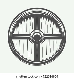 Vintage vikings shield. Can be used as logo, emblem, badge or print. Vector Illustration. Monochrome graphic art.


