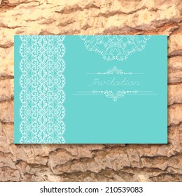 Vintage Wedding card or invitation with abstract lace background and borders on a realistic wood texture