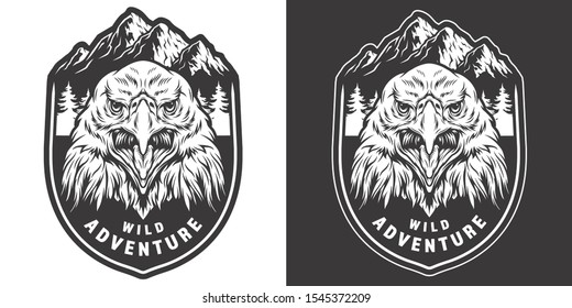 Vintage wild animal monochrome badge with aggressive eagle head on mountains and forest landscape isolated vector illustration