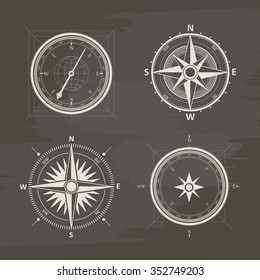 Vintage wind rose compasses in set. Isolated vector chalk drawn compass.