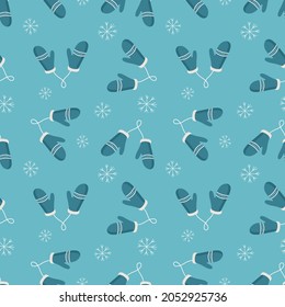 Vintage winter seamless pattern with white mittens and snowflakes on blue background. Vector illustration