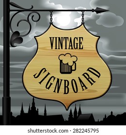 Vintage wooden street  signboard hanging on forged brackets against the background of the old city at night and cloudy sky with the moon. Vector Illustration