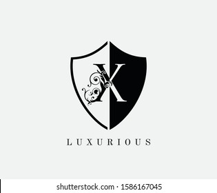 Vintage X Shield Letter Logo Icon. Black and White X With Classy Leaves Shape design perfect for fashion, Jewelry, Beauty Salon, Cosmetics, Spa, Hotel and Restaurant Logo. 