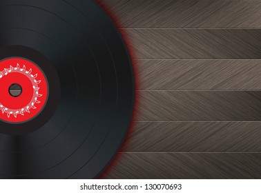 Vinyl Music Background with vinyl disk in the left of the image on a wood floor.
