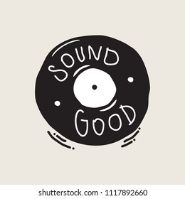 Vinyl record with handwriting text, 'Sound Good'. Creative musical illustration in black and white.