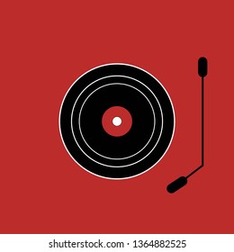 Vinyl record for listening to retro music, jazz or classics. On a red background, black vinyl, rest and relaxation.